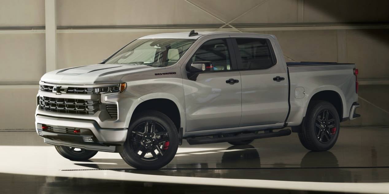 2025 Chevrolet Silverado in gray parked in a showroom