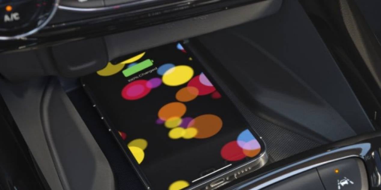 close up view of a cell phone placed in the compartment of a 2025 Chevrolet Trax