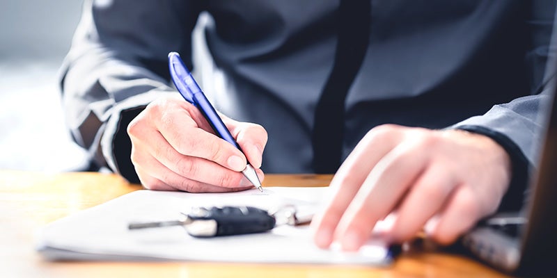 i.g. Burton Chevrolet of Seaford in Seaford DE customer signing financing paperwork