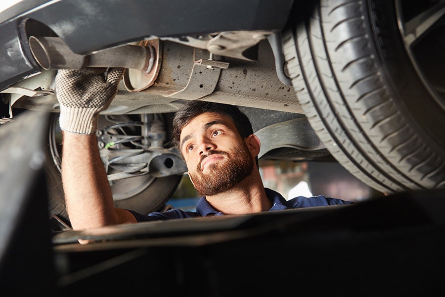 Service tech working on a car