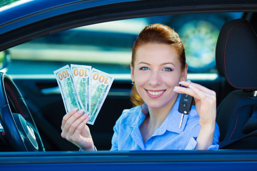 Woman with money and car keys